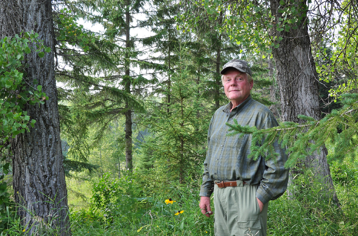 Man standing in woods