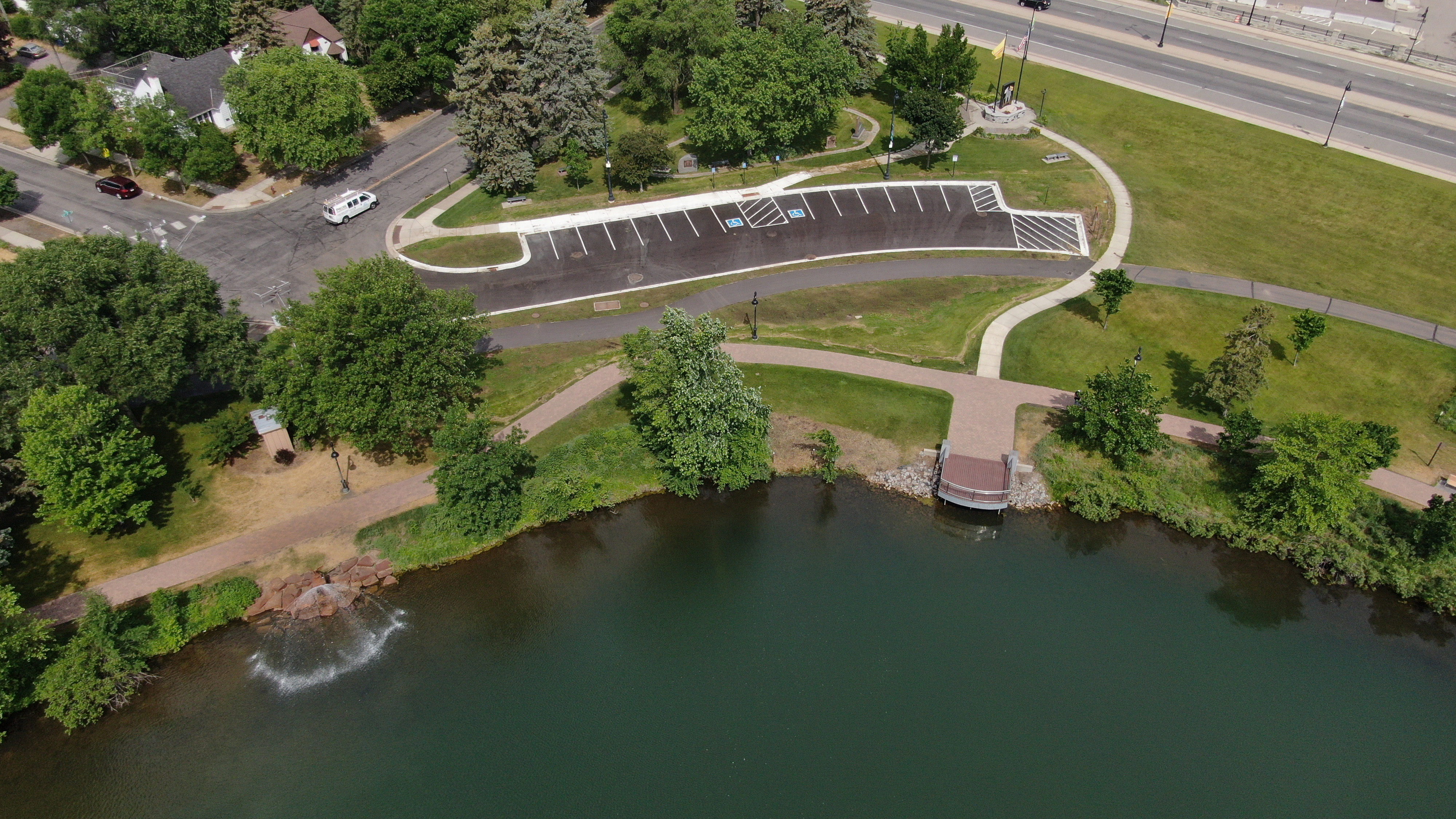 Aerial view of lake's edge and parking lot where underground project was installed