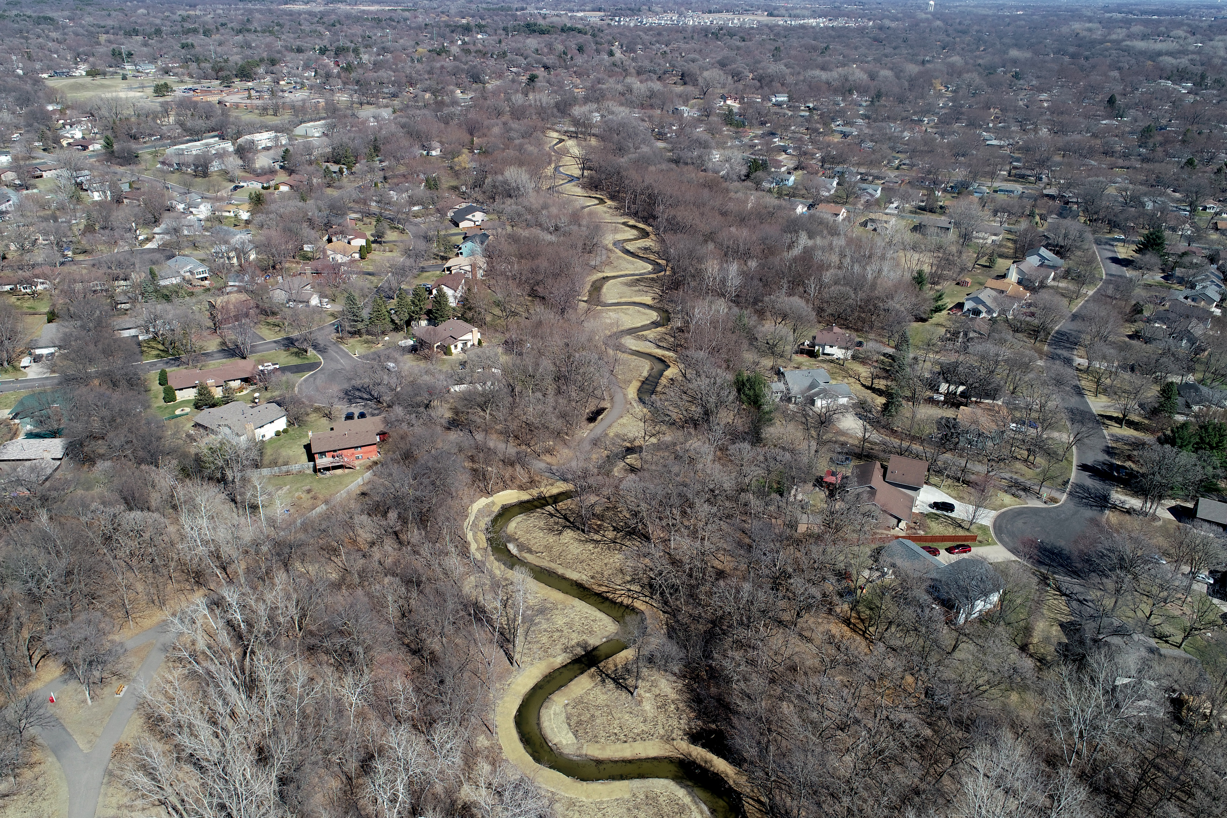 An aerial view of the remeandered Middle Sand Creek looks upstream from the BNSF Railway stream crossing on April 1, 2021
