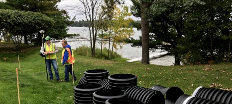 workers survey site of stormwater treatment project