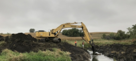 crane excavating stream