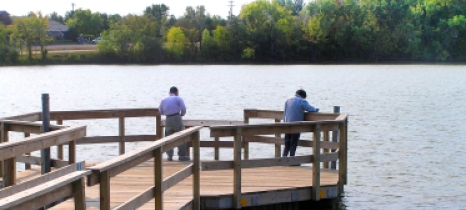 Two anglers fish from a pier on Silver Lake