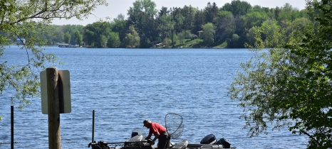 Man at dock prepares to launch boat