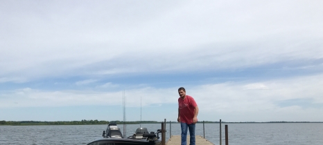 man on dock in lake