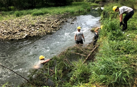 People restoring river banks