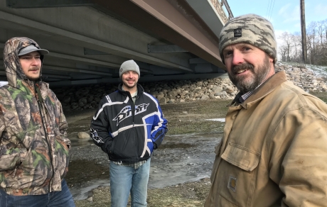 Pennington SWCD staff stand in front of the Greenwood Street bridge, which spans the Red Lake River in Thief River Falls.