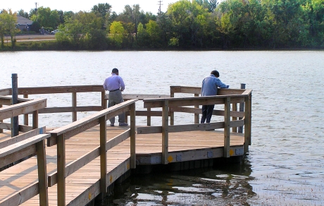 Two anglers fish from a pier on Silver Lake