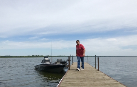 man on dock in lake